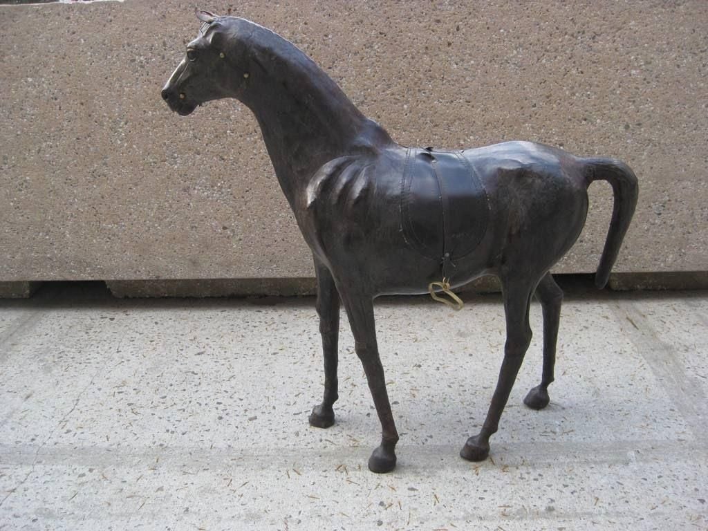 Leather horse sculpture and toy, we provide rentals for stylists, photo shoot and props for movie sets, this item is on sale for a clearance price.