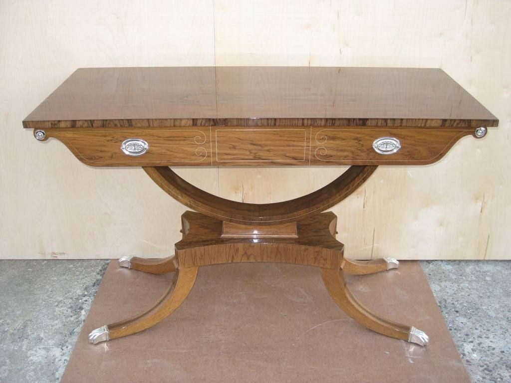 Spectacular bleached rosewood high style Regency floating entry or sofa table console with Art Deco elements. 