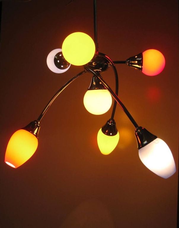 Whimsical Italian Mid-Century Modern chandelier after Stilnovo, with three adjustable arms, recently wired, with American light bulb adapters and 110 volt ready, we provide rentals for stylists, this pendant fixture can be adapted to chain or we can