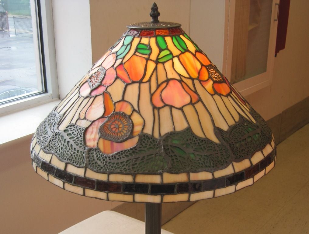 Stained glass table lamp in the manner of Tiffany.
