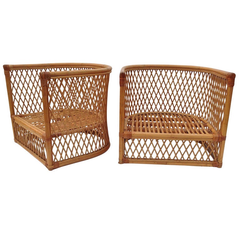 Pair of barrel wicker and rattan chairs in the manner of Jean Royere's Riviera Collection, this pair is currently being restored and we will include cushion upholstery WCOF all inclusive.