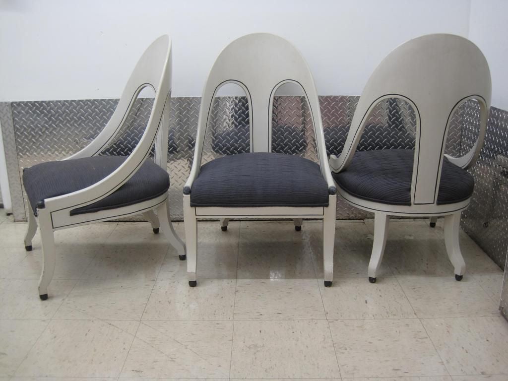 Very stylish set of three spoon back slipper chairs, this item is on sale at a clearance price, available individually.