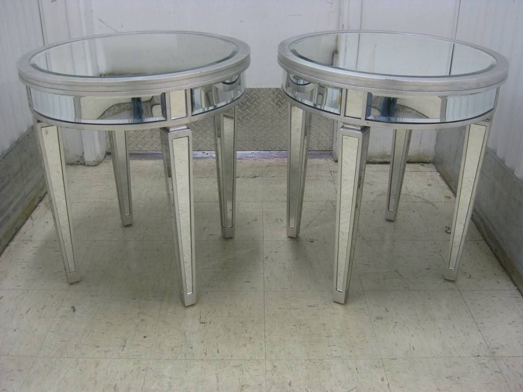 Pair of tall Hollywood end or center tables in silver leaf and 1' bevel.