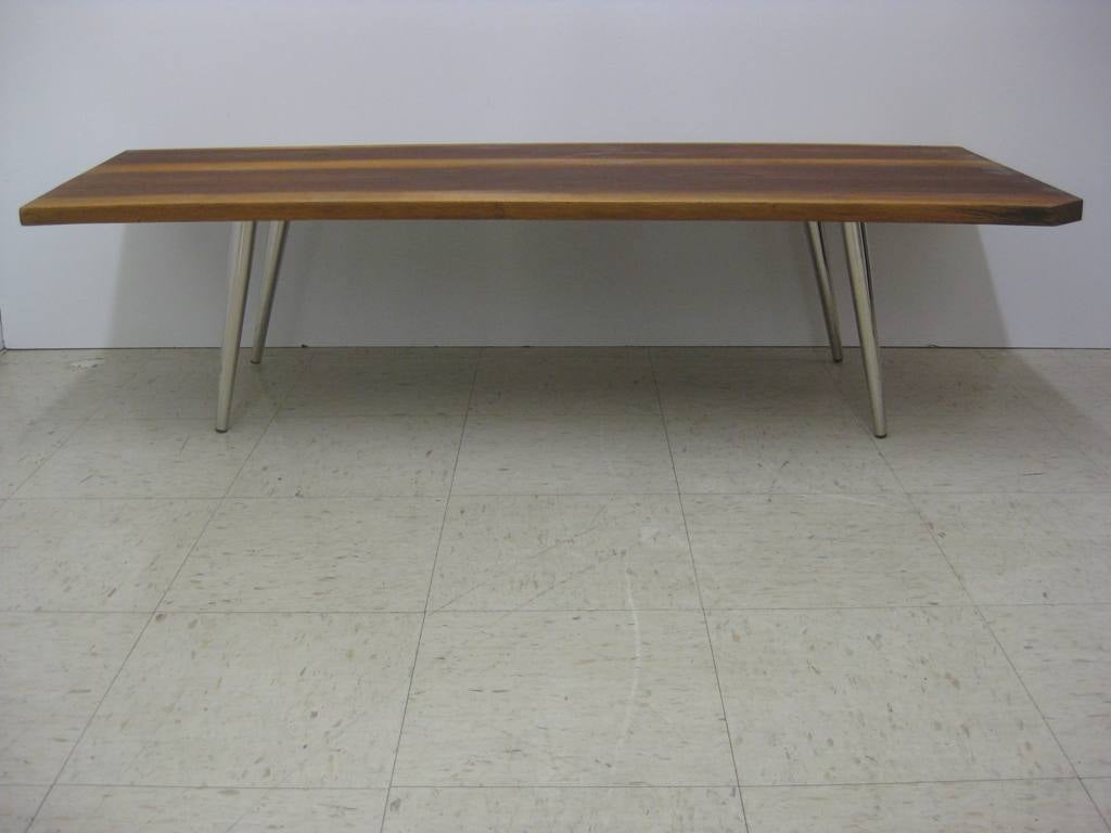 Flat board with nickel legs cocktail table in the manner of George Nakashima, unmatched pair, available individually, $1800 for the pair.  This item has been reduced for clearance at a sale price.