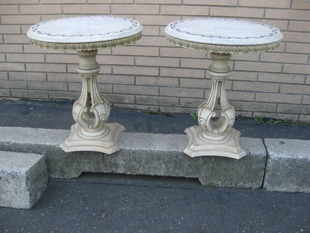 Pair of Petite White Marble top with black chariot wheel carving detail Regency end and or side tables.  This item is on sale for a clearance price.