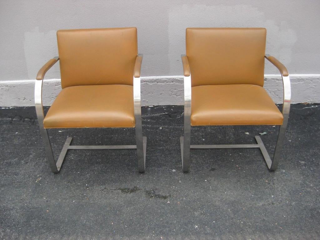 Pair of Ludwig Mies van der Rohe Bruno Flat Bar Sled Polished Stainless Steel Leather Chairs for Knoll with Arm Pads.