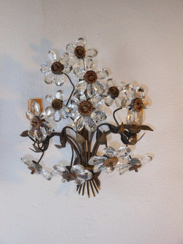 c1920 extremely rare pair of crystal daisy flower sconces found in the South of France.Heavy detailed bronze frame with the perfect amount of patina with gorgeous crystal daisy flower prisms! Housing 2 lights,bulb holders are in wood.All new rewired