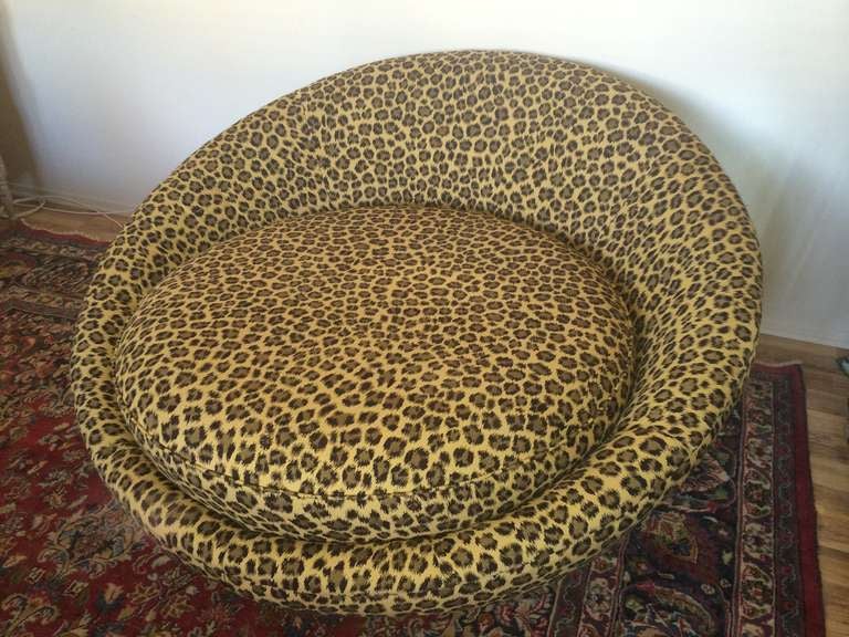 Fabulous round vintage sofa with new indoor outdoor custom designer leopard fabric. Sitting on 4 dark wood legs~