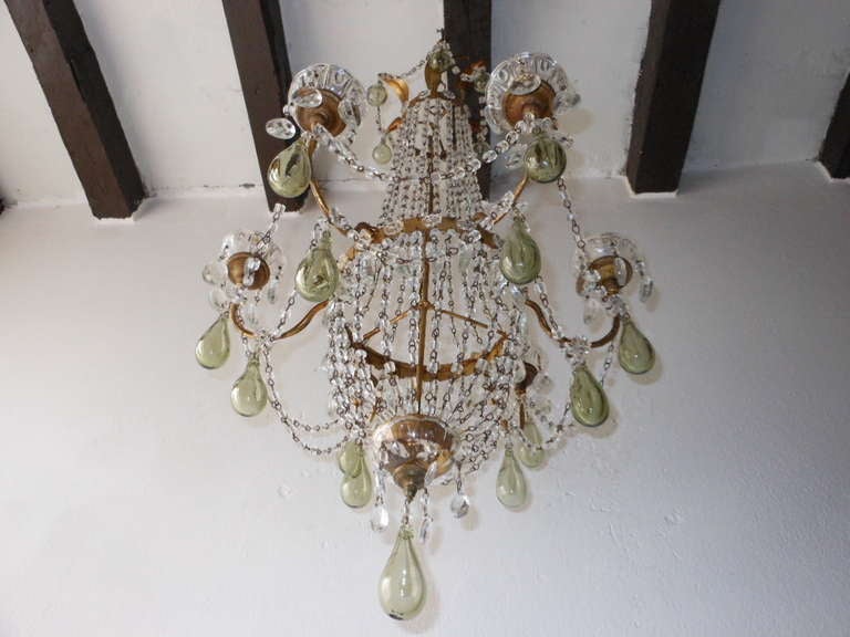 Superb c1890 French empire chandelier just picked up in the South of France.Stunning hand blown light green crystal drops.Housing 5 lights sitting in crystal bobeches on top of gilded gold wood cups.Gold metal body dripping with crystal macaroni