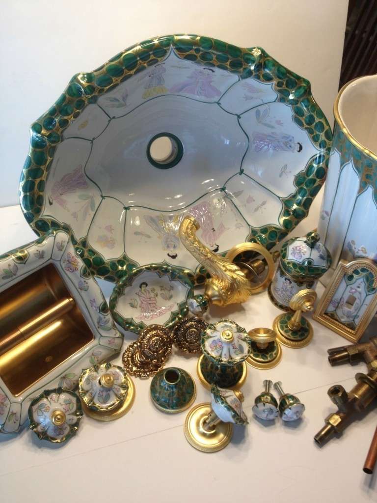 A stunning 37 piece collection of a Sherle Wagner green chinoiserie bathroom suite.Includes:
30 pieces of all china... Bathroom sink,toilet paper holder,waste basket,sink faucet handles,towel bar brackets,light switch,canister,soap dish,door