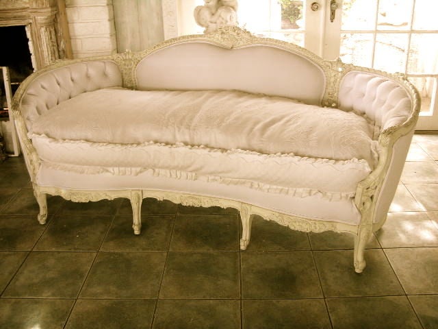 THIS GORGEOUS VINTAGE SOFA HAS GOT IT ALL,,BEAUTIFULLY CARVED WOOD TRIM SURROUND THE ENTIRE FRAME,,RECENTLY UPHOLSTERED IN A THICK WHITE COTTON CANVAS,,AN ADDITIONAL WHITE LINEN SLIPCOVER PROVIDES PROTECTION FROM DIRT  PLUS WASHES NICELY,,THE EXTRA