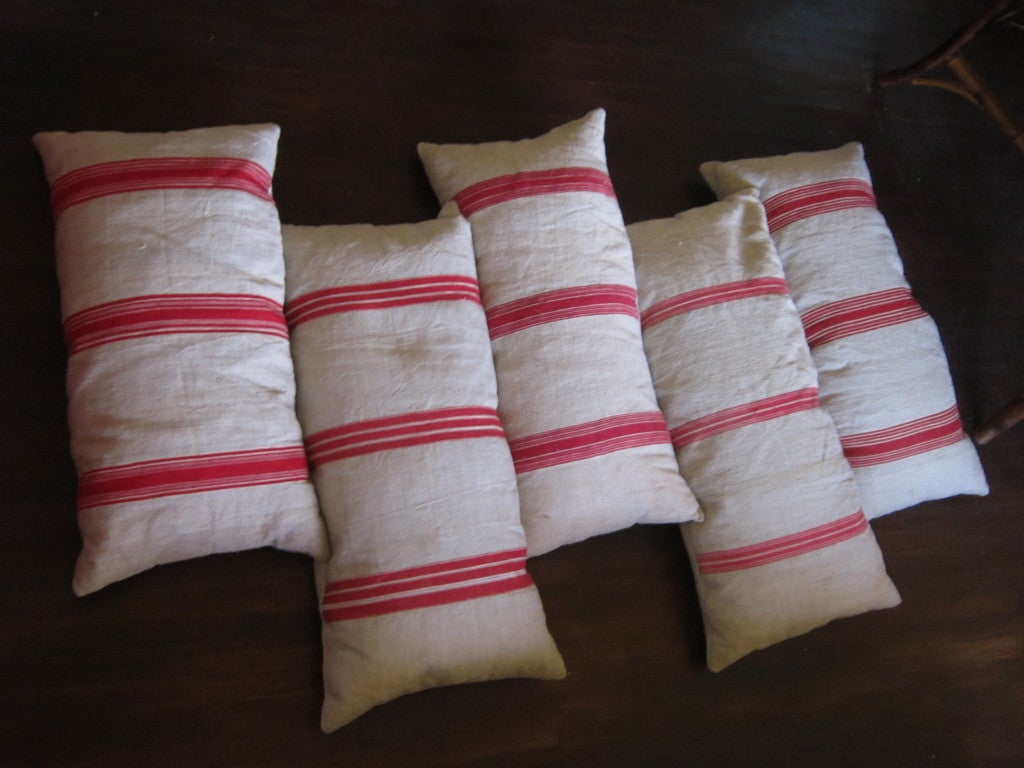 5 FABULOUS vintage French muslin red stripped cushions..They all vary in sizes with down filling.2 have minor water marks on back.Let me know if you would like more pictures.
They range from 34 long 18 wide to 36 & 38 long.Might also have 3 more