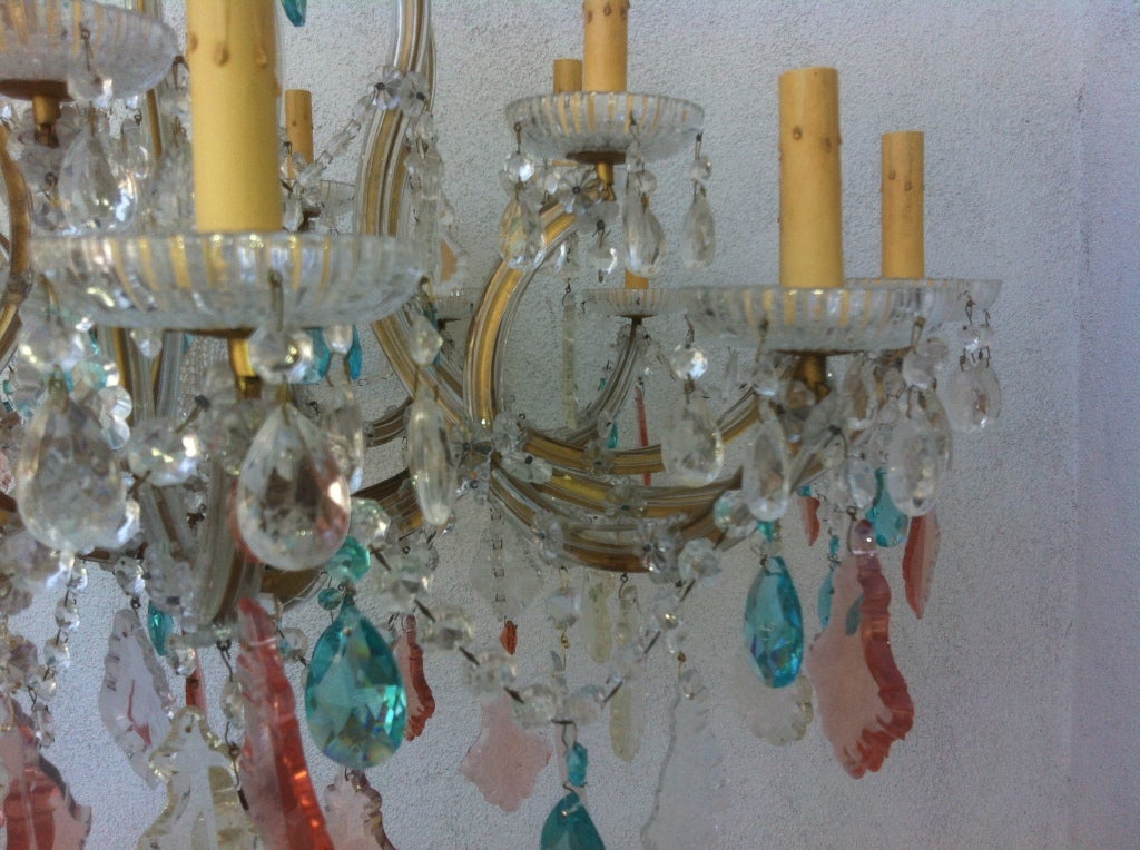 Fabulous over the top giant vintage glass arm 19 lights, pink and turquoise crystal chandelier.With center light covered by vintage beaded bulb cover.2 crystal drop globes~