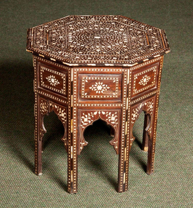 A middle eastern bone inlaid late 19th/early 20th century octagonal low end table.  Another near matching table is also available.