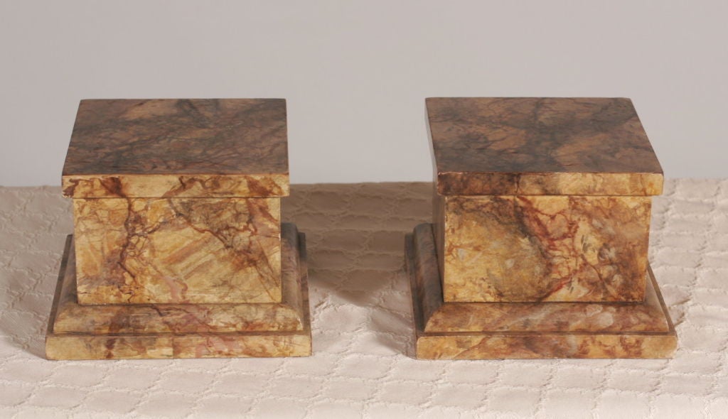 A pair of English late 19th century faux marbleized stands.