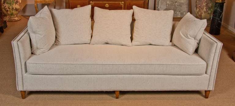 Two 1970s nickel nailed sofas with walnut legs; one a three-seat, the other a loveseat.

Loveseat: 26