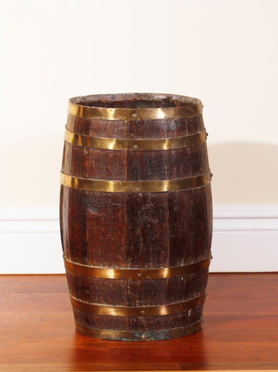 An English Oak 19th Cent brass bound whiskey barrel now as an umbrella stand