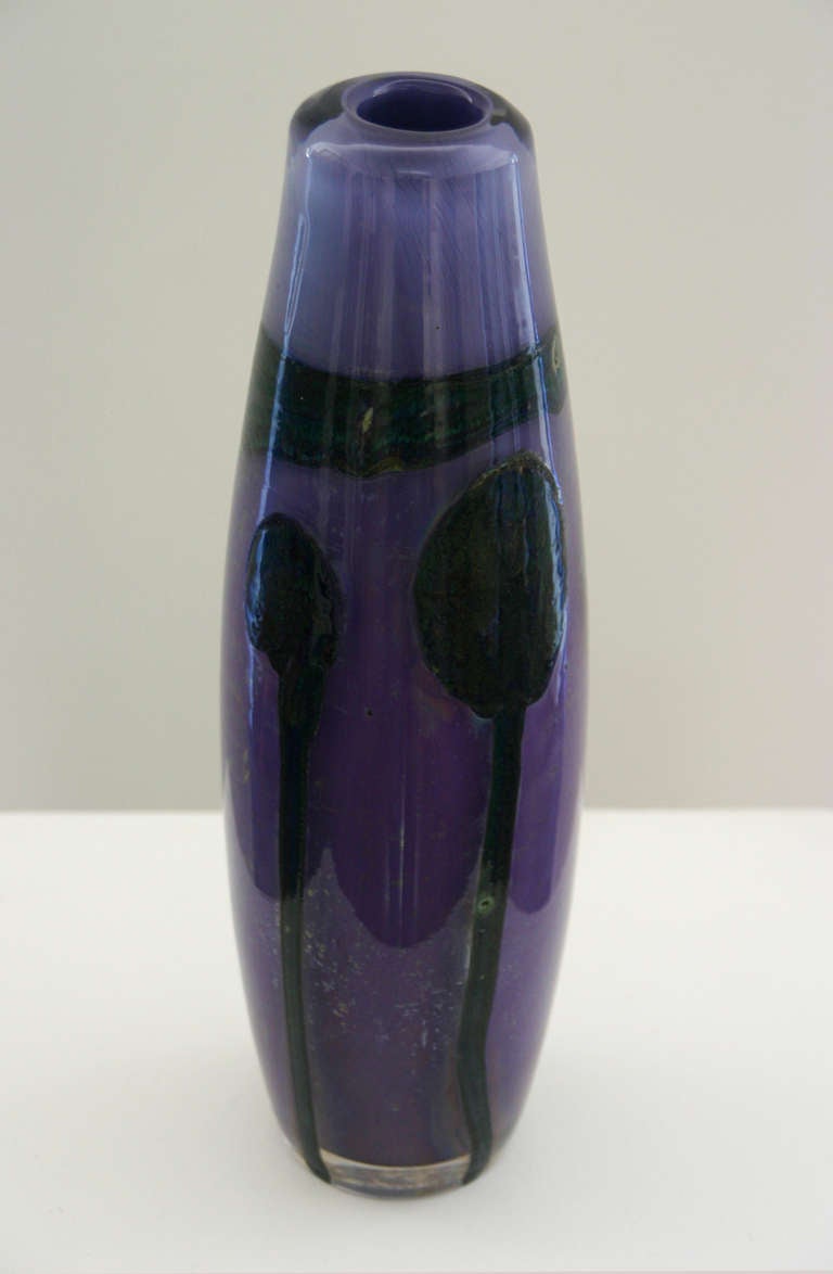 A Val Saint Lambert Studio glass vase in violet decorated with thick black pigment embedded in the glass by Samuel Herman. Signed SJH.
Herman produced approximately 100 individual pieces for Val Saint Lambert from October 1970.
His works are now