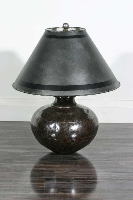 An early 20th century polished steel lamp

Shade: 20