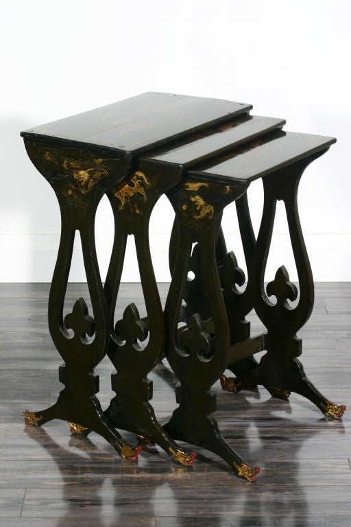 A set of English mid-19th century black lacquer and Chinoiserie decorated nest of three tables.