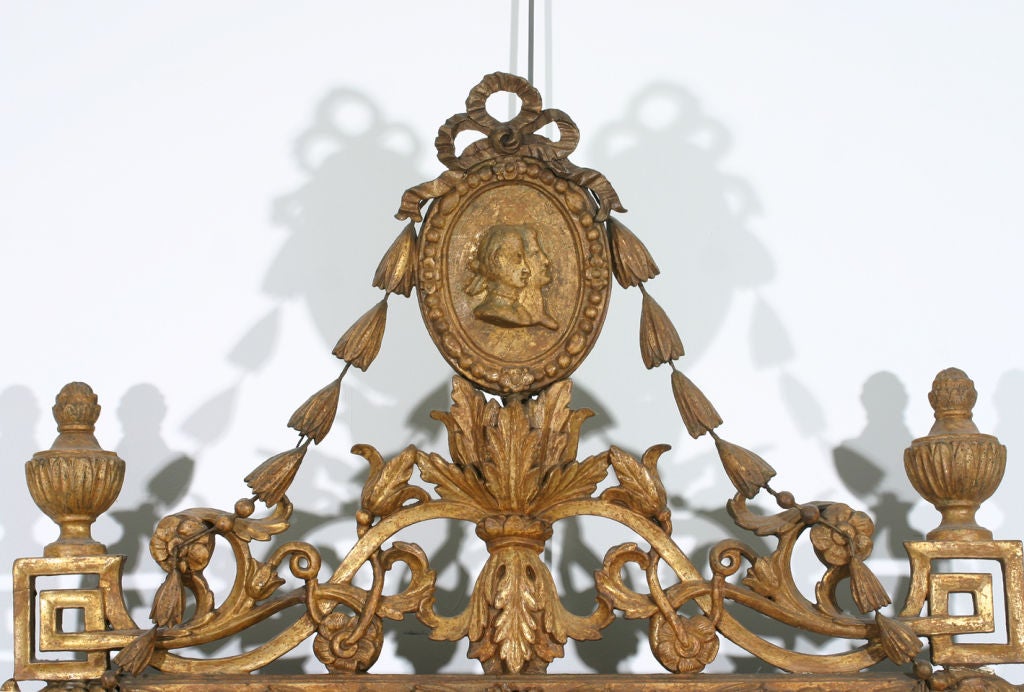 A Danish late 18th century carved neoclassical gilt mirror.