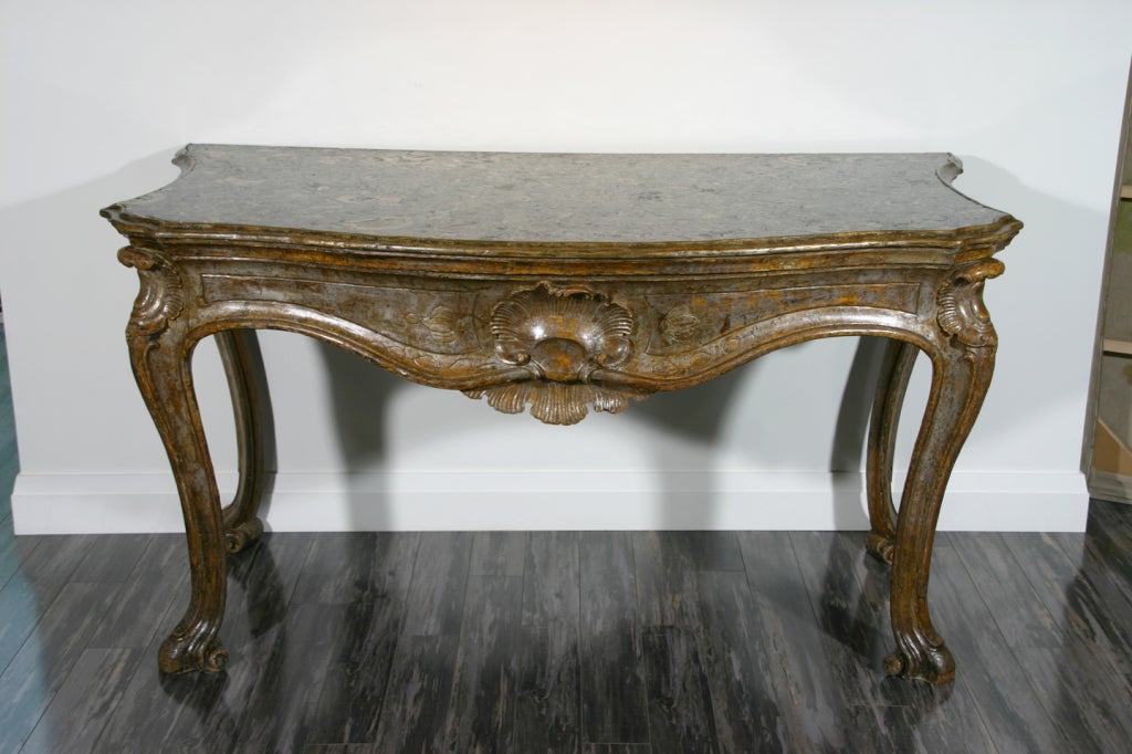 An Italian Mid. 18th Century Roman Silver Giltwood Console Table with original fossilised marble top