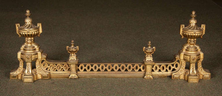 A French late 19th century Louis XVI style neoclassical adjustable ormolu fire fender with urn decoration. Adjustable from 36 inches to 45 inches.