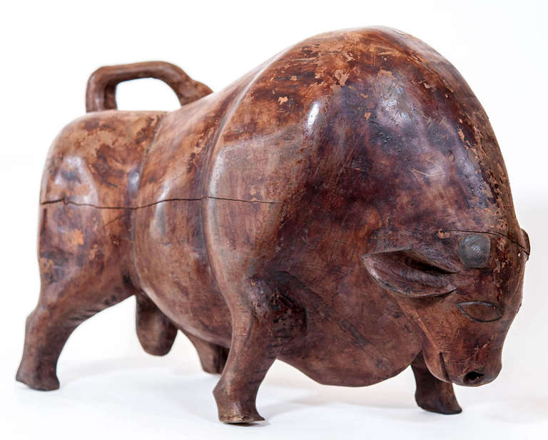 A powerful carved wood bull or toro of magnificent proportions and great 
patina....Horns were lost in battle!