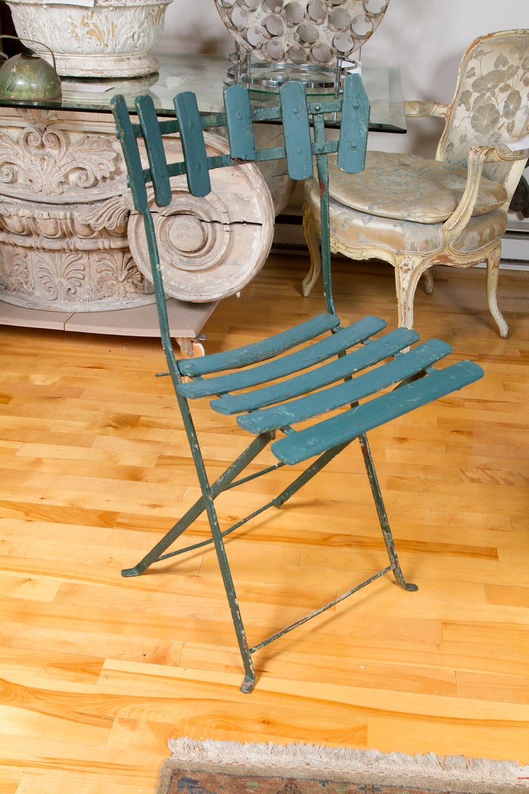 Pair of French antique garden or bistro iron green painted folding chairs.