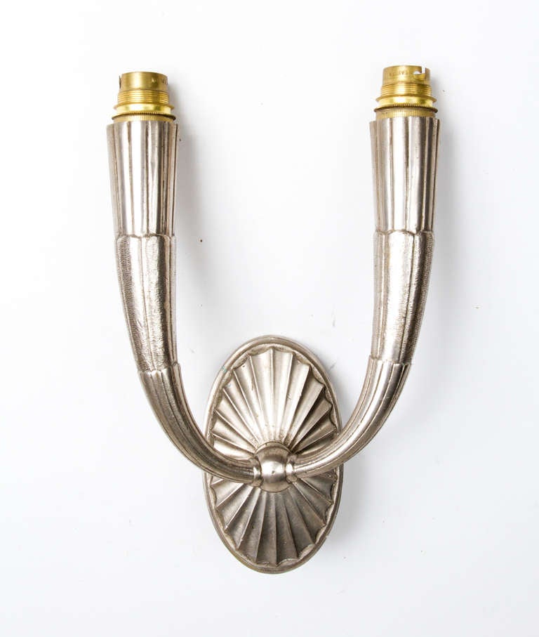 Pair of nickel plated bronze Art Deco sconces in the manner of Ruhlmann.