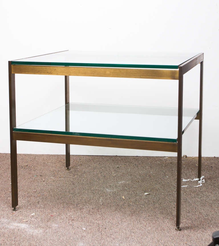 Mid century modern bronze and plate glass two tier side table.