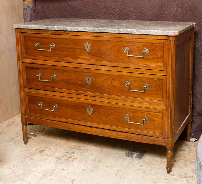 French Provincial Louis XVI period walnut commode with original mottled grey marble top.
