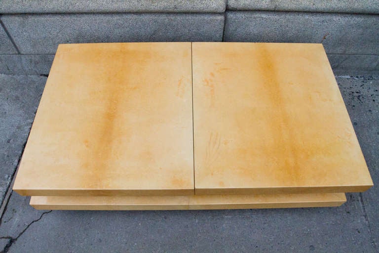 Modernist lacquered goatskin coffee table by Aldo Tura, the top opens to reveal a mirrored bar compartment.