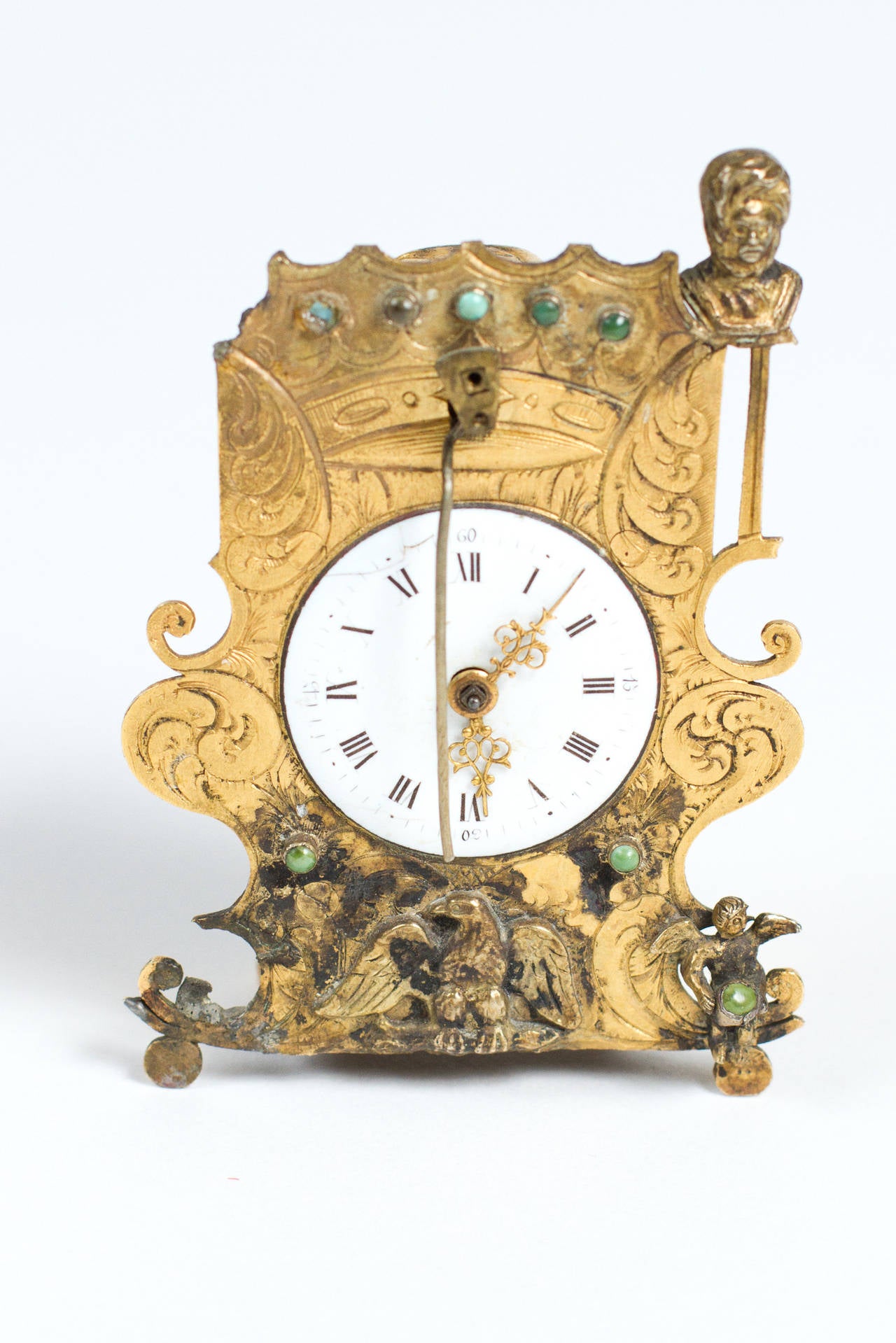 Gilt Austrian Zappler miniature owl's tail pendulum clock with gilt scrolls decorated with eagles, angel and turquoise stones and  figural ottoman turk finial. Provenance Liliane M. Stewart Estate Imperial Tobacco