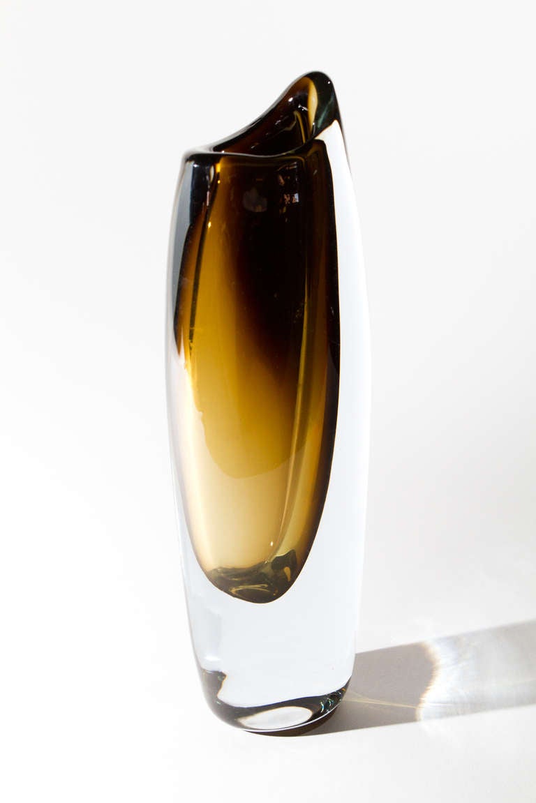 Flattened and slightly bulbous cylindrical forms with asymmetrical rims, with off-centre and graded smoky brown glass. Sweden Circa 1955.
