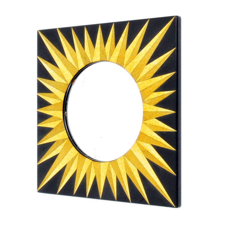 Rare and beautiful square shaped mirror with sunburst design by Piero Fornasetti bearing Fornasetti sticker.