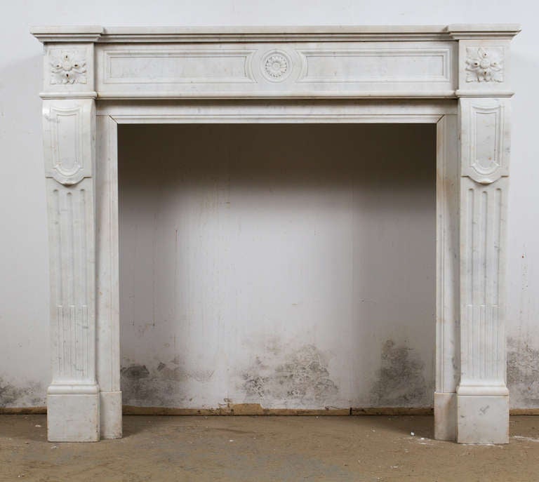 White Carrara marble Louis XVI style mantlepiece.

Interior dimensions: W 33