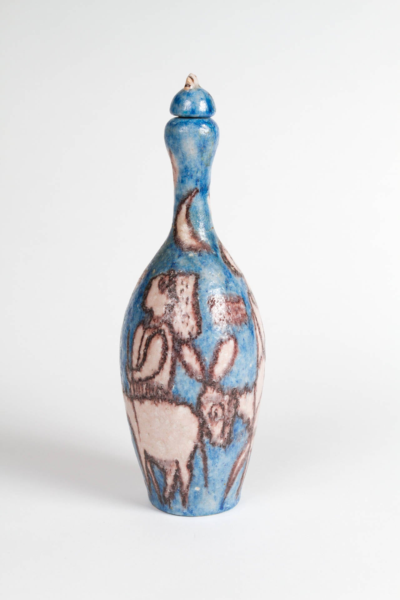 Whimsical Ceramic pitcher with lid depicting peasants with donkeys.