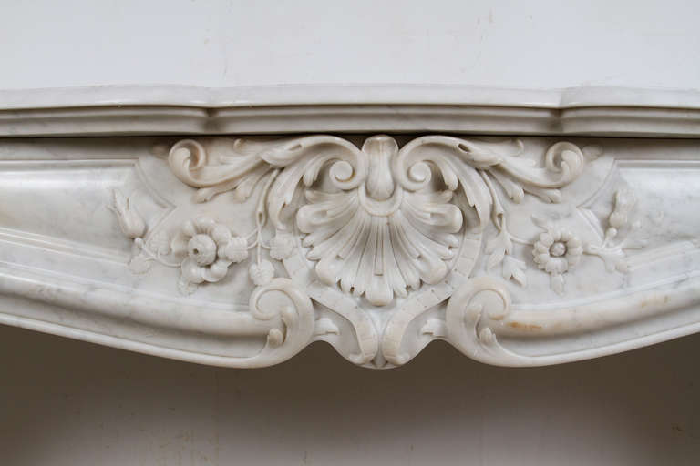 Louis XV style white carrara marble mantel piece.

Interior dimensions: W: 44.5