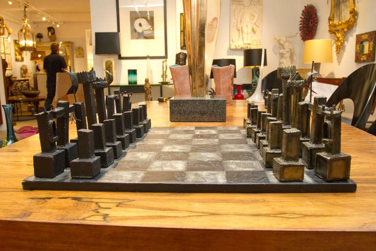 Rare brutalist welded steel chess set by Paul Evans. Chess board made of wood typical applied resin cement - silver and black patina.