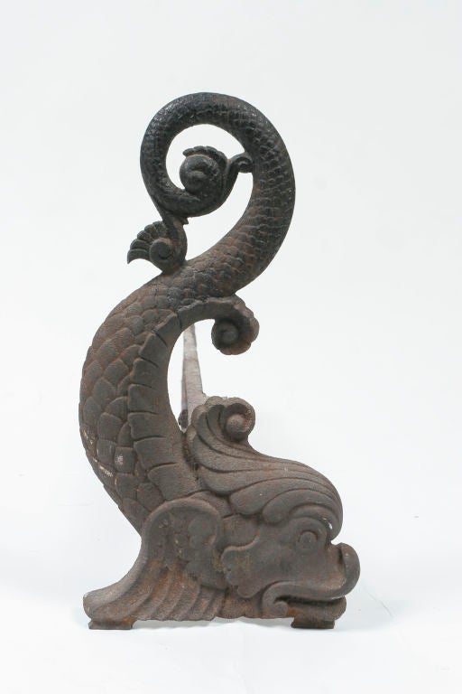 Pair of whimsical castiron dolphin shaped andirons. United-States.