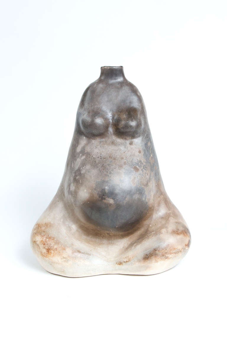 Unusual terracotta vase in the form of a pregnant woman.
Signed: RC 92.