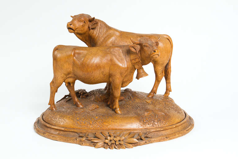 Beautiful Black Forest wood carving depicting two cows. Attributed to Johan Huggler.