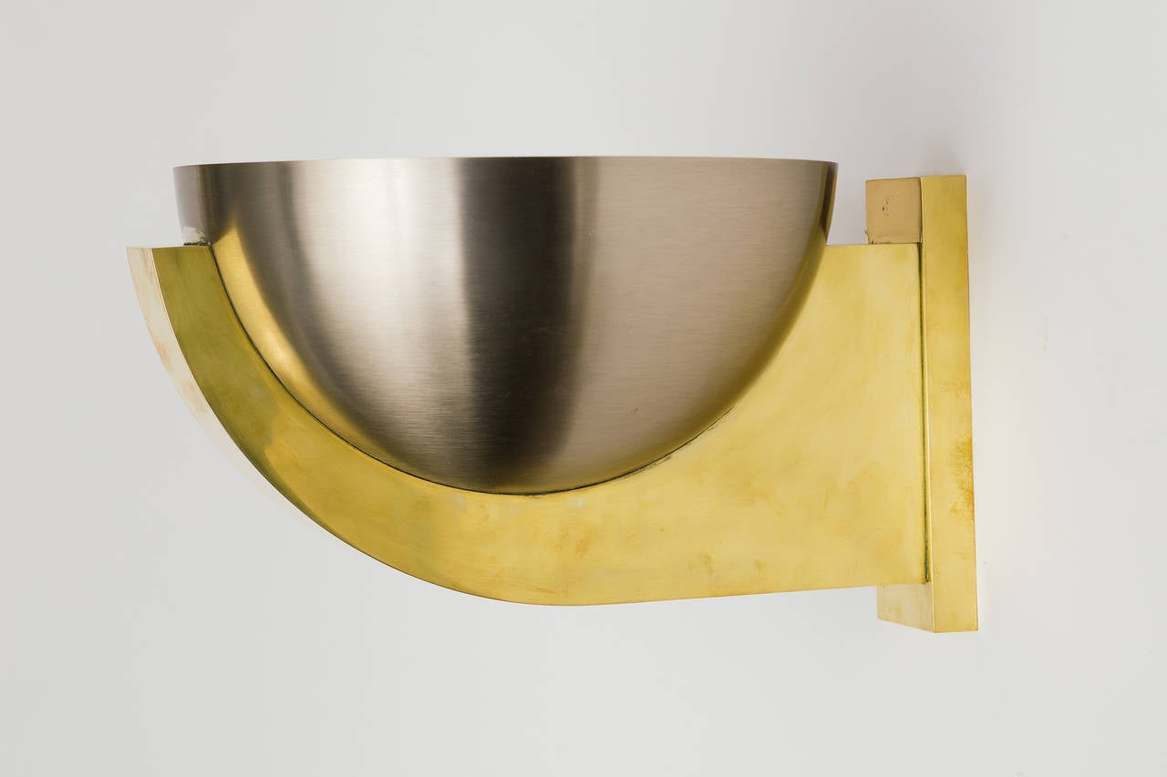 Pair of large brushed steel and polished brass spherical sconces by Perzel.