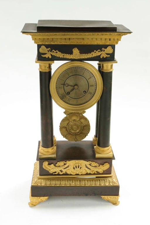 Restauation period gilt and patinated bronze clock.