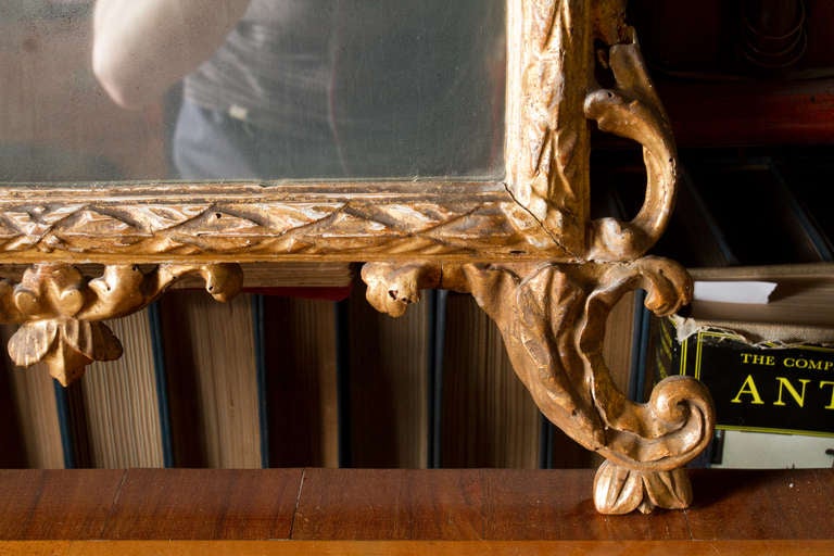 Beautiful 18th century neoclassical carved and giltwood Italian mirror.