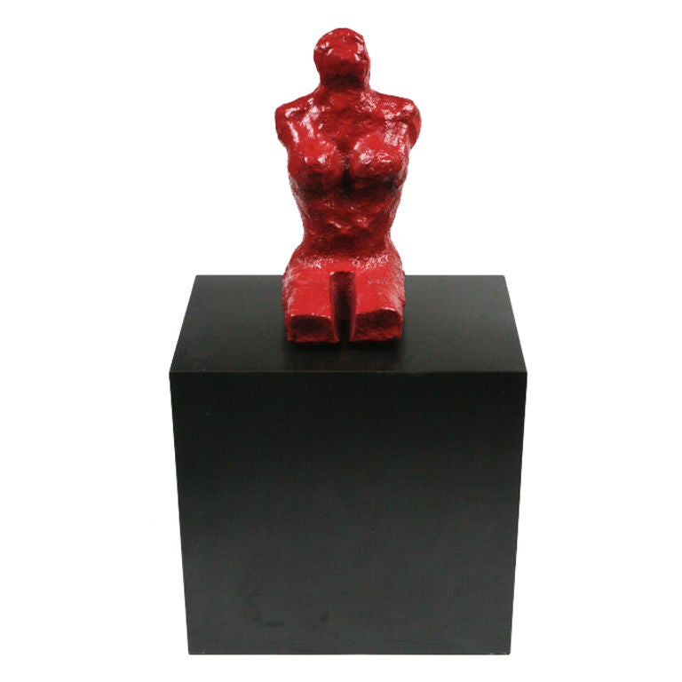 Interesting abstract cast-iron red lacquered sculpture on black plinth.