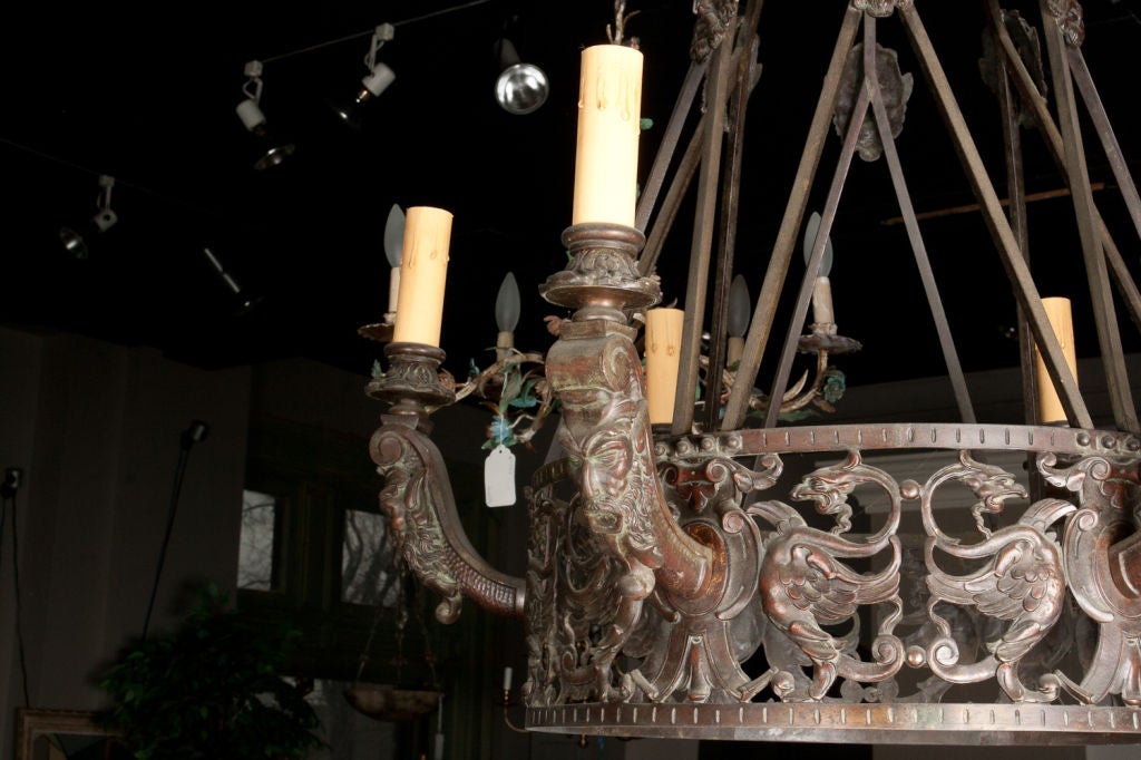 Renaissance style patinated cast bronze six light chandelier.
