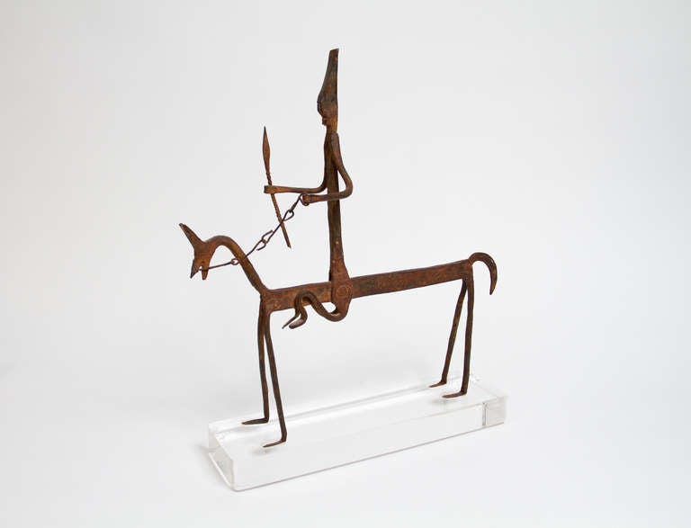Fine Bambara Bamana hand forged iron equestrian figure, which inspired Alberto Giacometti horseman sculpture. Mounted on a custom made acrylic base.
Provenance: Estate of Audrey Golden, a prominent Montreal interior designer in the