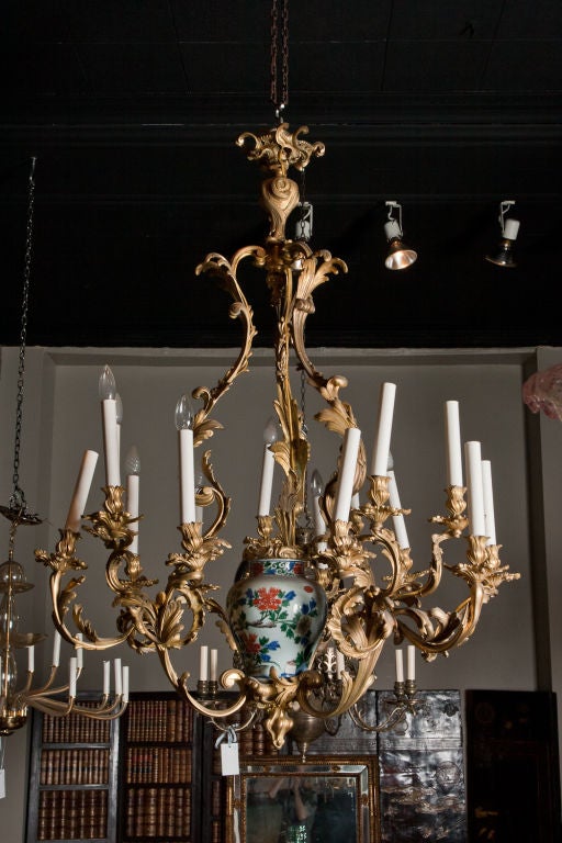 Important Belle Epoque Louis XV style finely cast gilt bronze 12 light chandelier fitted with an 18th century chinese porcelain jar.